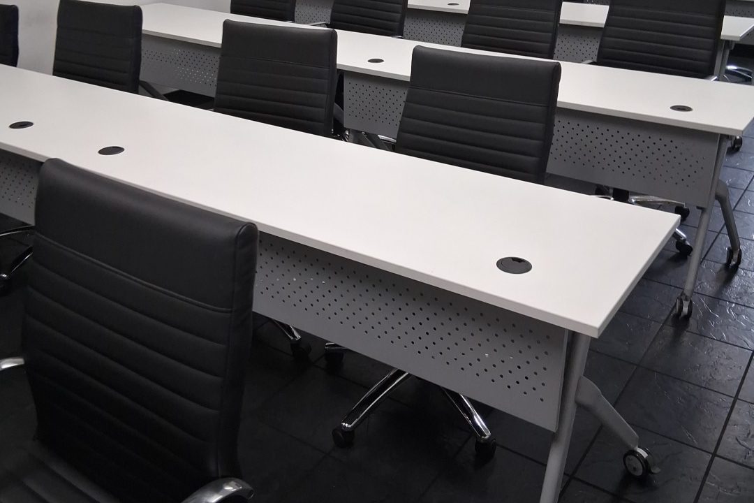 Clean commercial training room with tables and chairs in Columbus