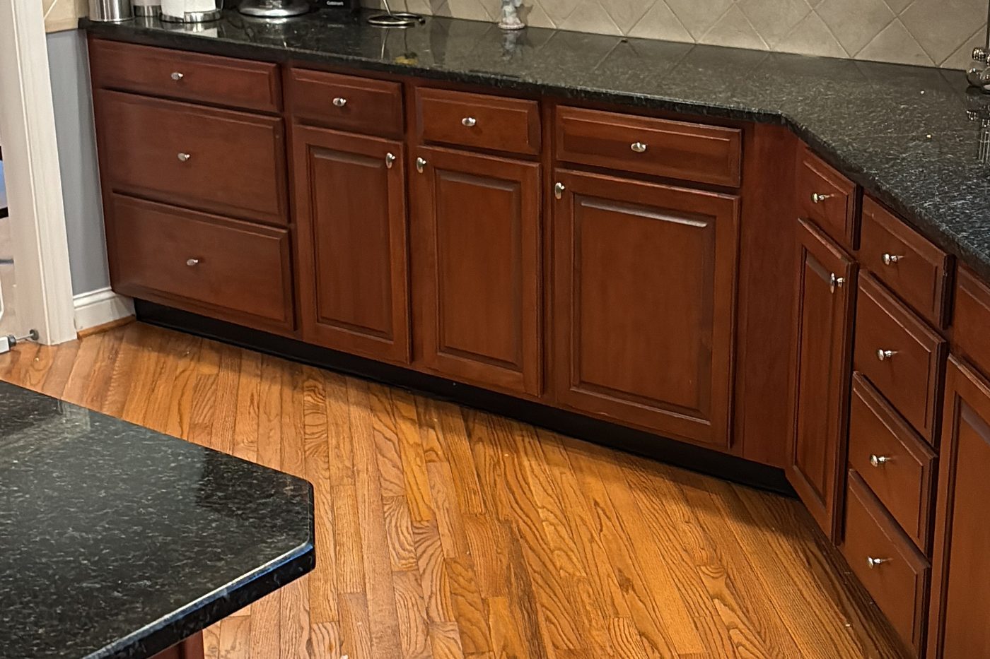 Finished Columbus kitchen with clean granite counters and hardwood floor